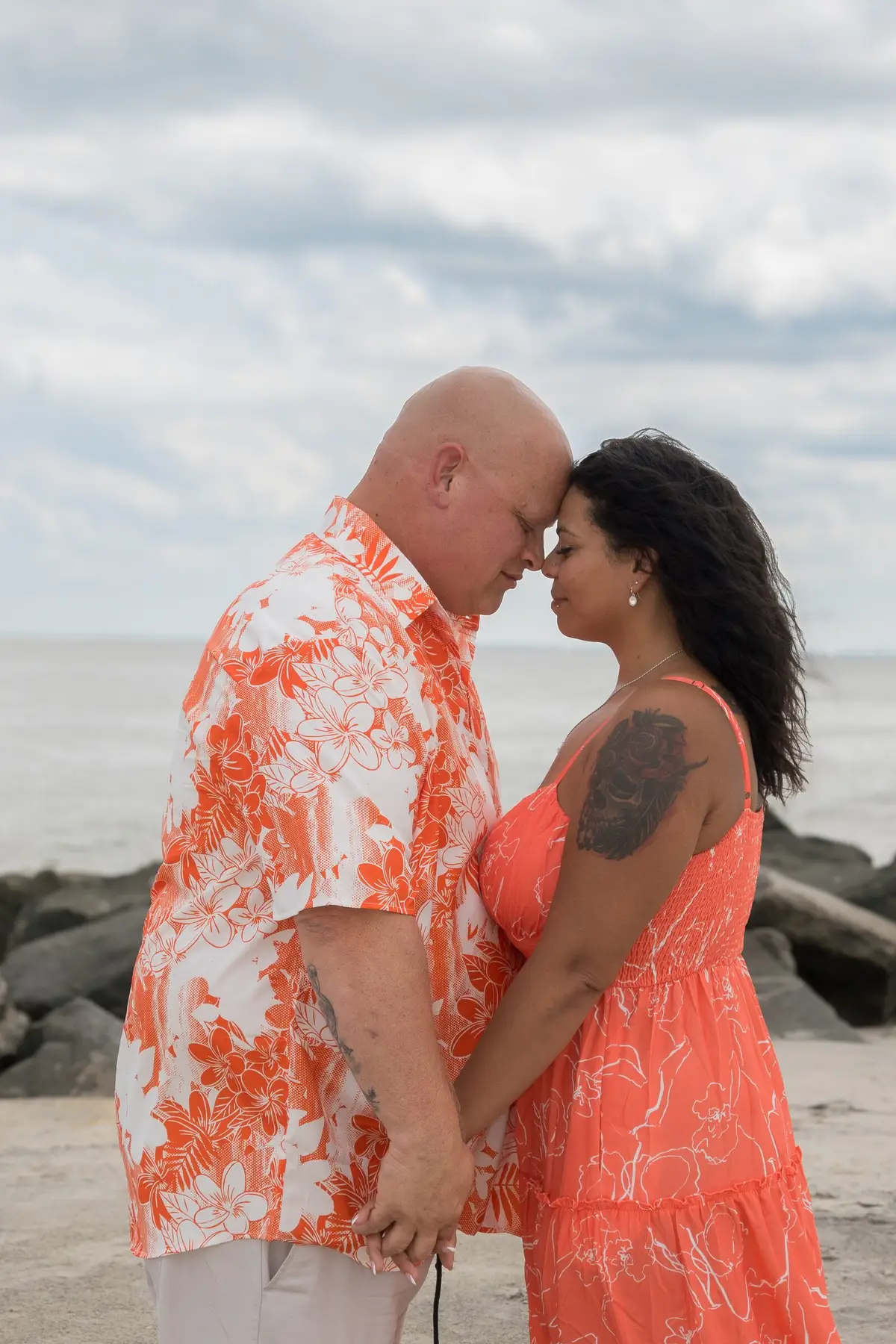 Couple on a boardwalk at night