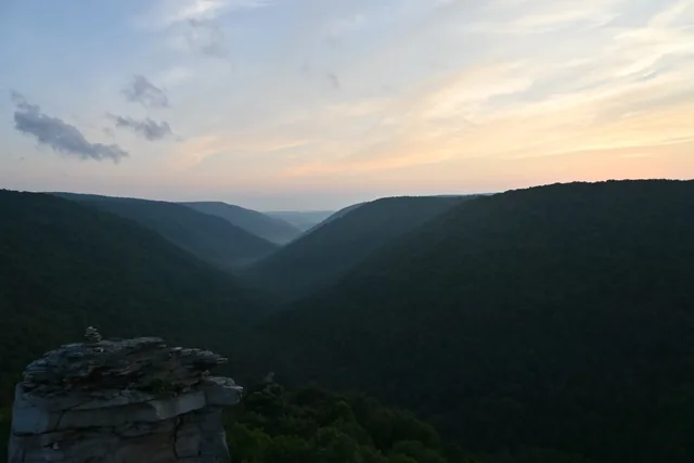 Sunset glow over a deep mountain gorge