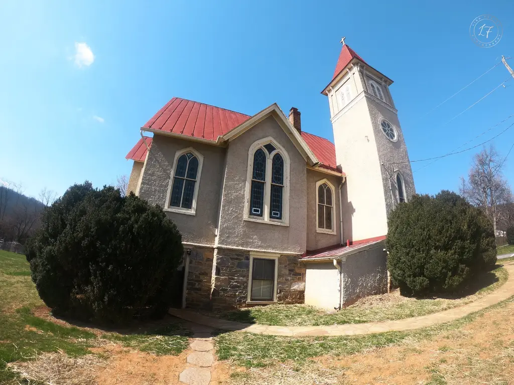 Historic country church with a red roof