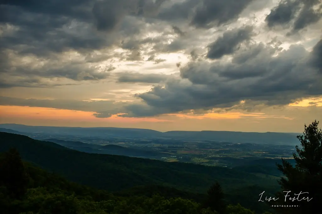Golden light under storm clouds over the Shenandoah Valley
