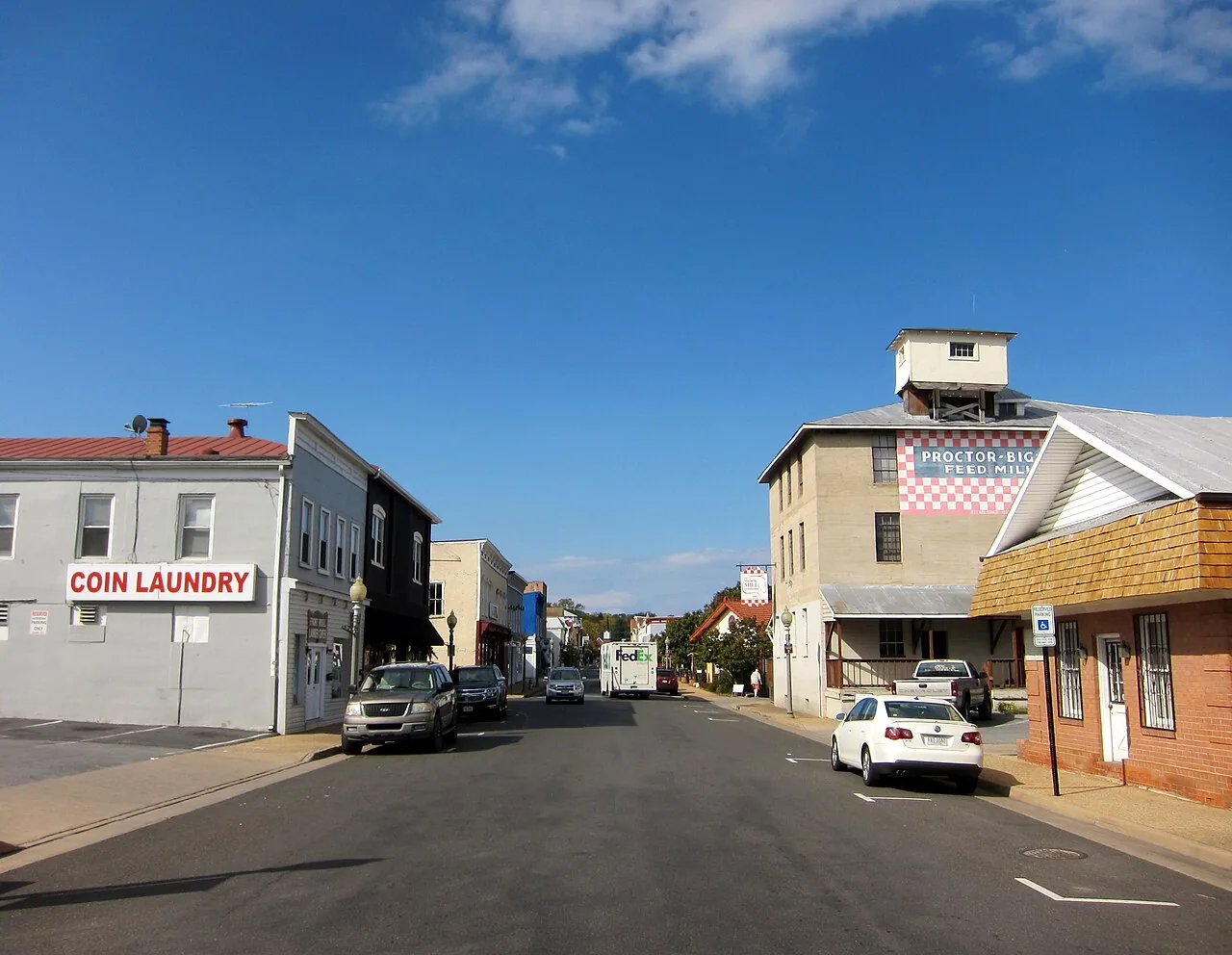 East Main Street in Front Royal, Virginia, with brick storefronts and a clock