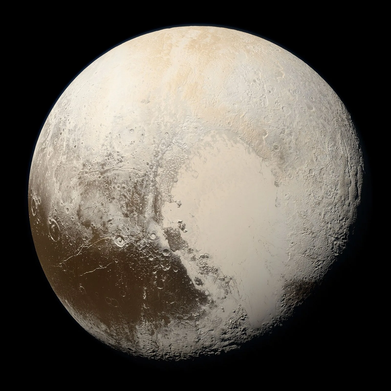 Pluto in true color from NASA's New Horizons, with a large pale heart-shaped region across its tan and reddish surface