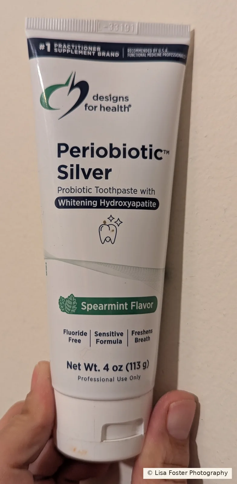 Designs for Health Periobiotic Silver toothpaste, Spearmint, in a white tube.
